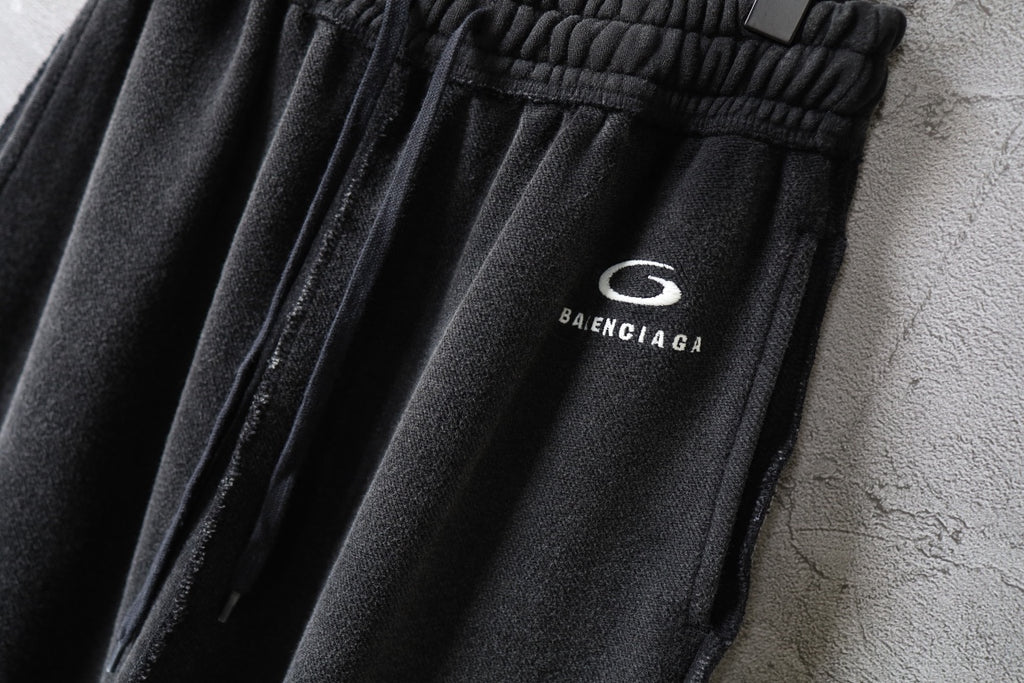 Balenciaga logo patch on dark drawstring pants waistband