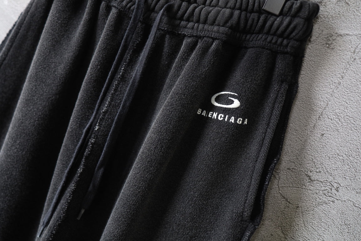 Balenciaga logo patch on dark drawstring pants waistband
