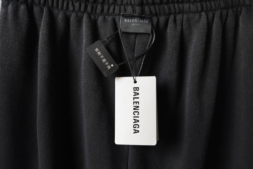 Balenciaga dark pants with elastic waistband and hanging tags