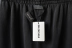 Black pants with Balenciaga hang tag on elastic waistband