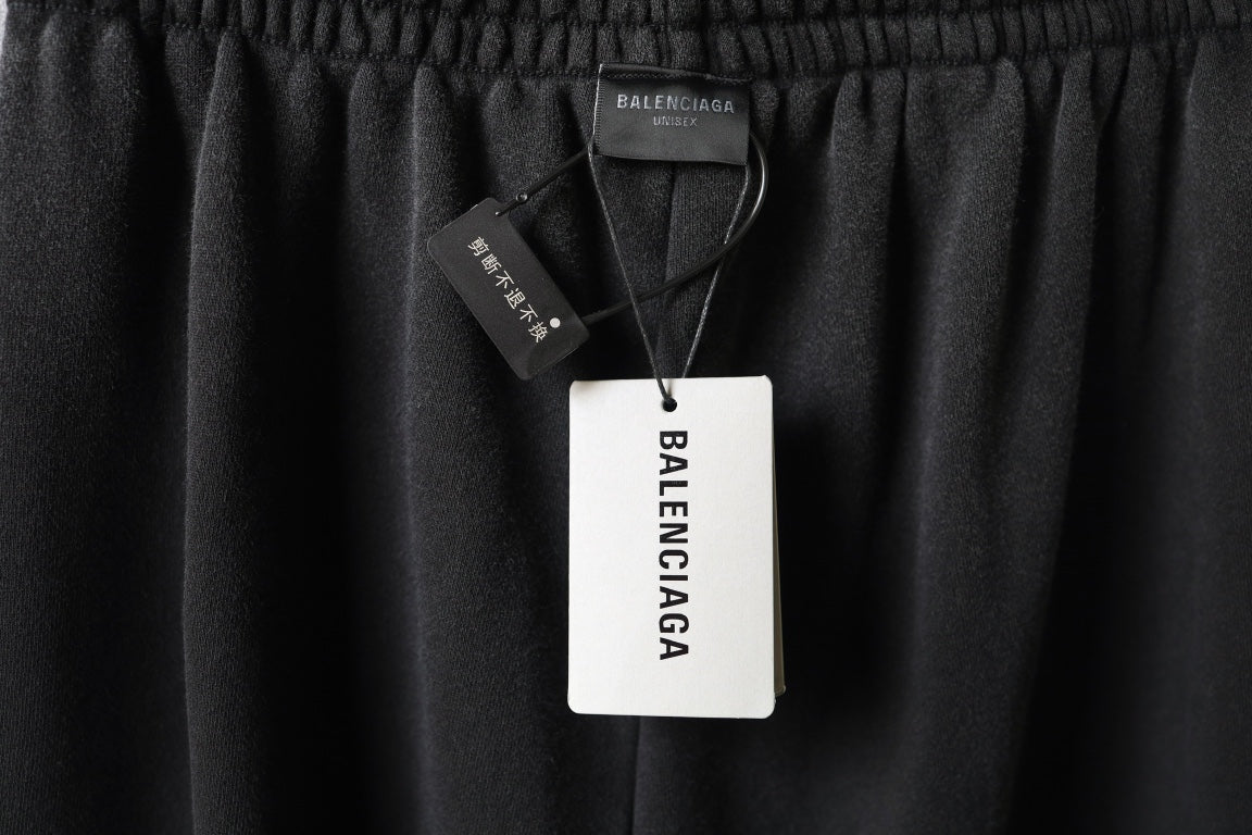 Black pants with Balenciaga hang tag on elastic waistband