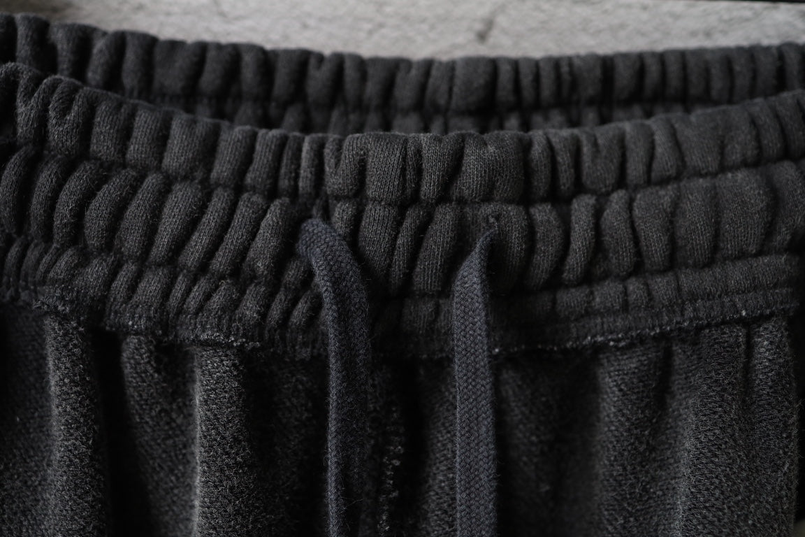 Balenciaga elastic waistband and gathered drawstring on dark pants