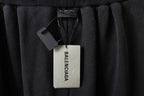 Balenciaga pants with hangtag attached at the inner waist