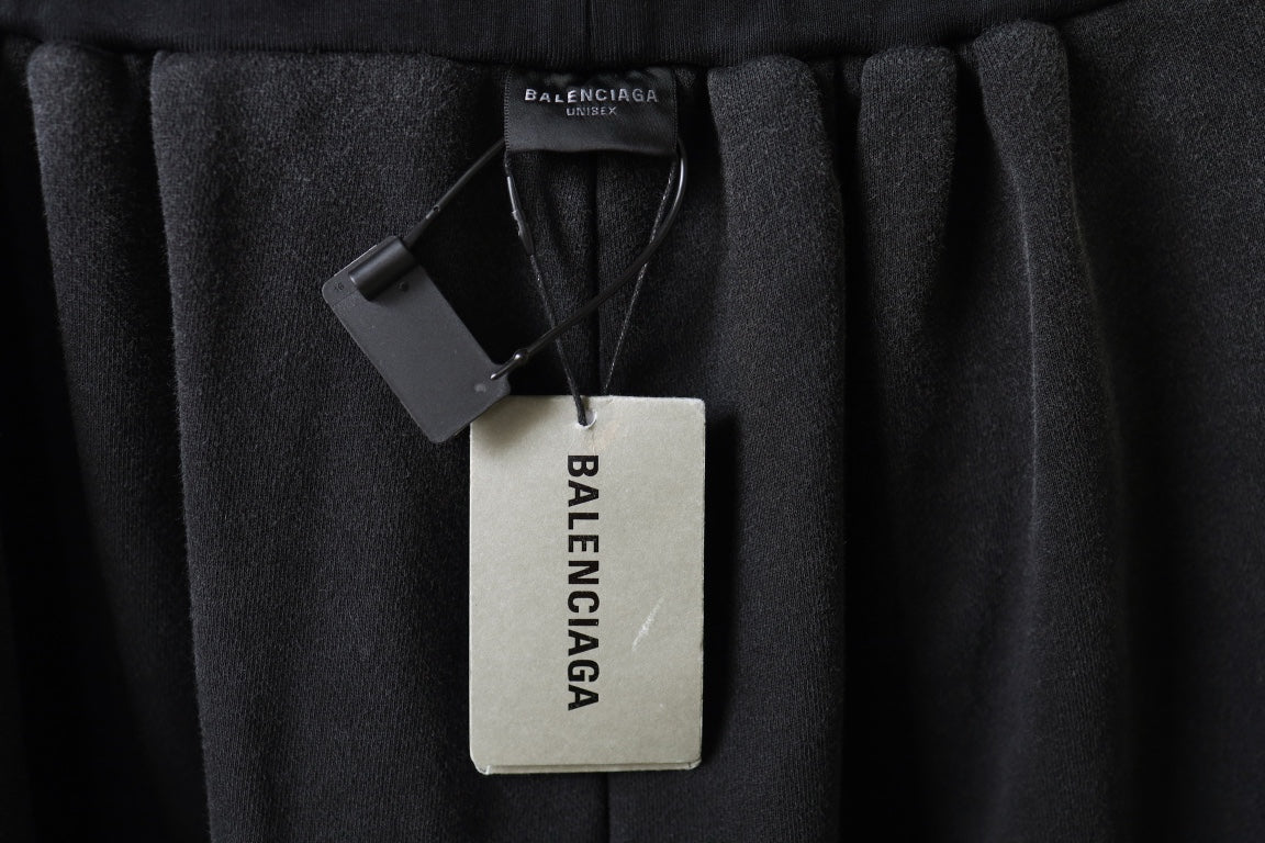 Balenciaga pants with hangtag attached at the inner waist