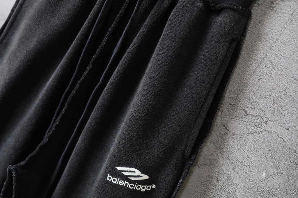 Balenciaga pants logo on side of gathered fabric