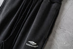 Balenciaga black pants with gathered drawstring waist and leg logo.