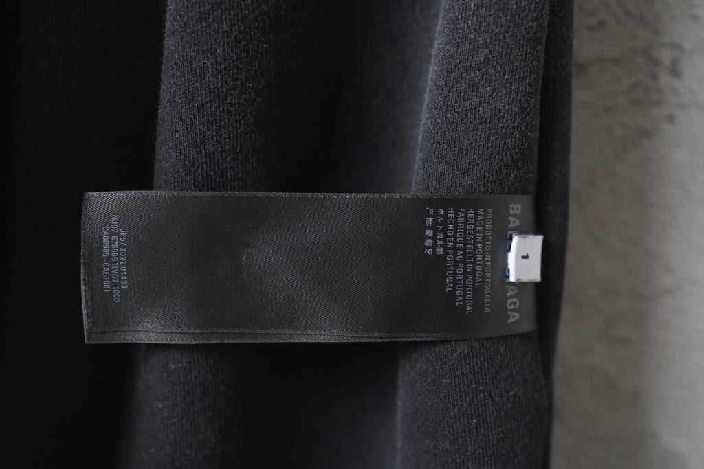 Balenciaga inner size label on black pants waistband.