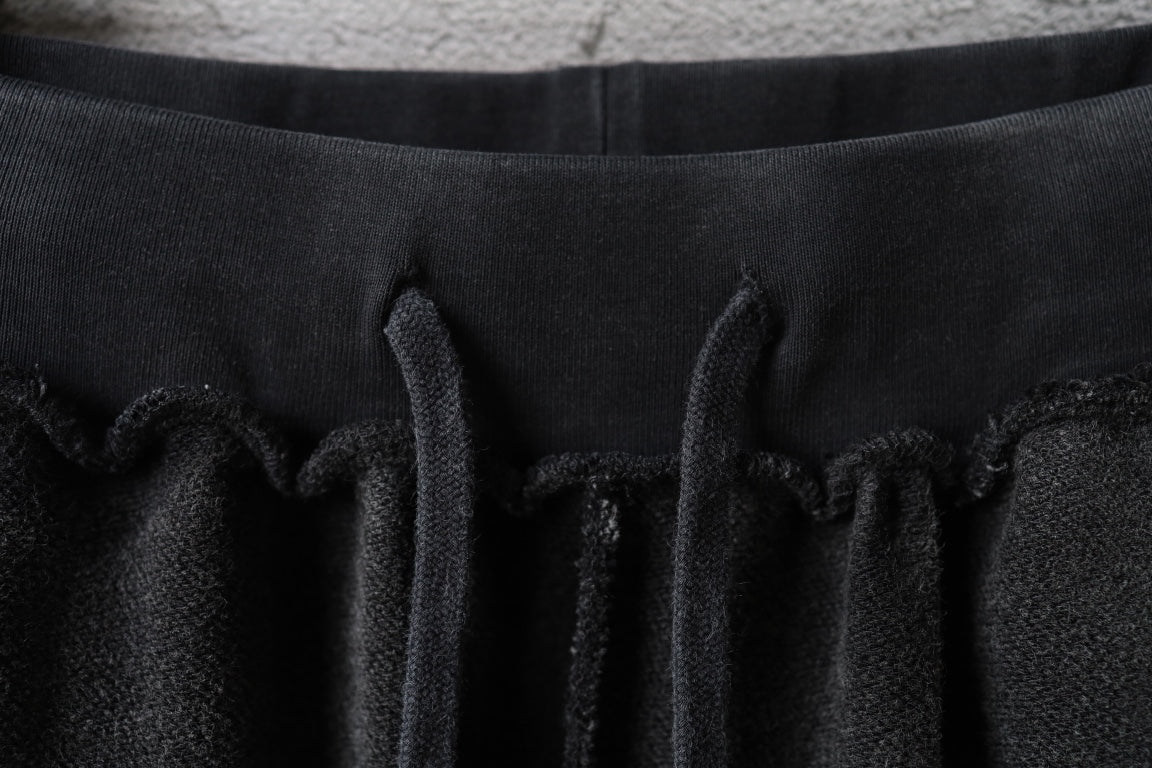 Balenciaga elastic waist with drawstring detail on dark pants