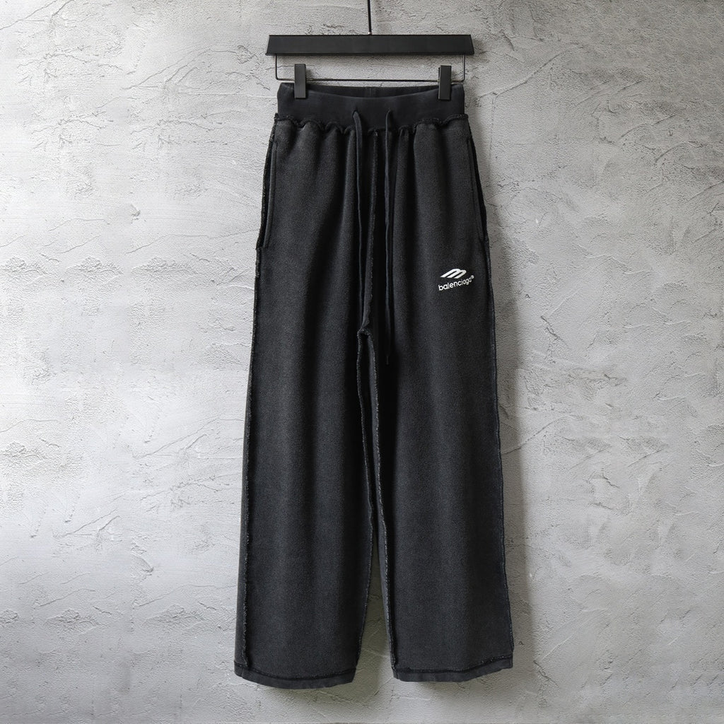 Balenciaga black wide-leg pants with elastic waistband and side logo