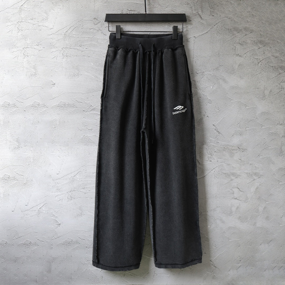 Balenciaga black wide-leg pants with elastic waistband and side logo
