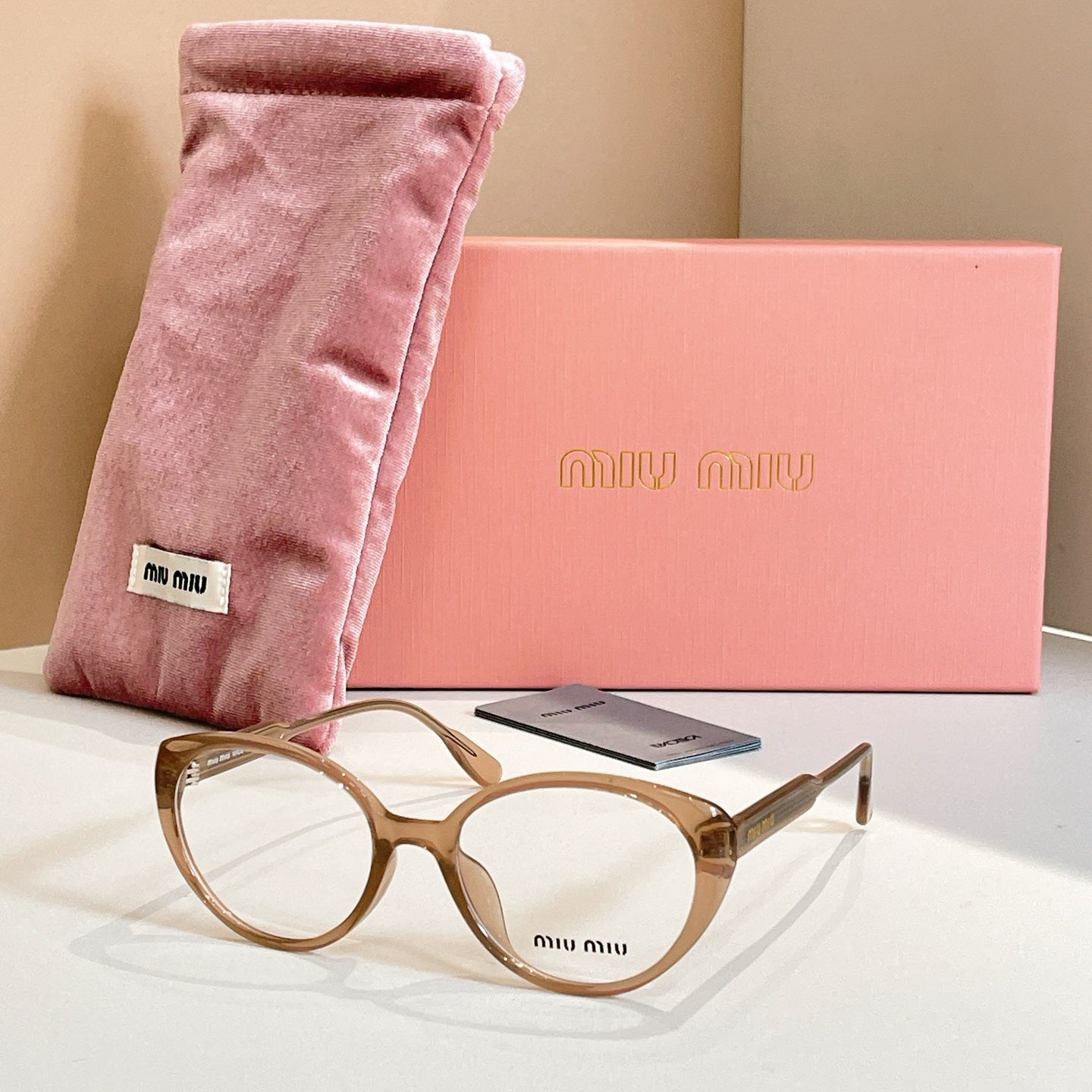 MiuMiu eyeglasses with brown tortoiseshell full-rim frames and logo on bridge