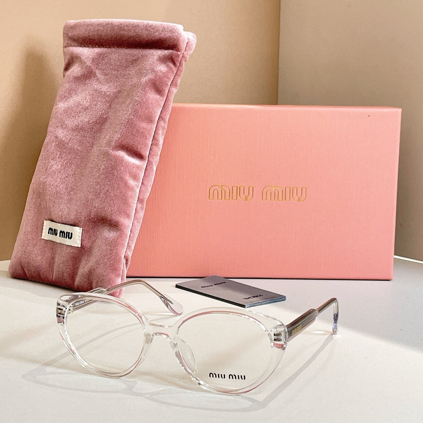 MiuMiu eyeglasses with clear full-rim frames and silver-toned temples