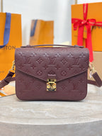Louis Vuitton mini flap shoulder bag, dark plum monogram, gold front clasp.