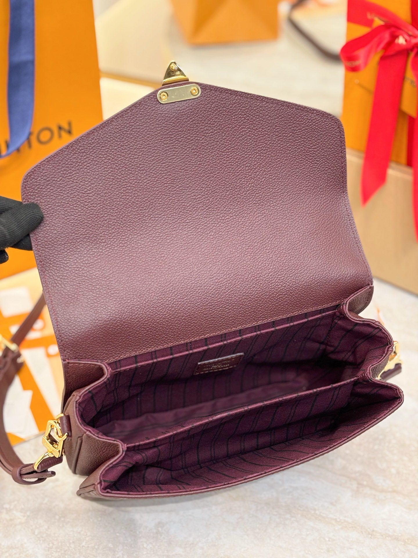 Louis Vuitton mini flap shoulder bag, dark plum, open interior with plaid lining.