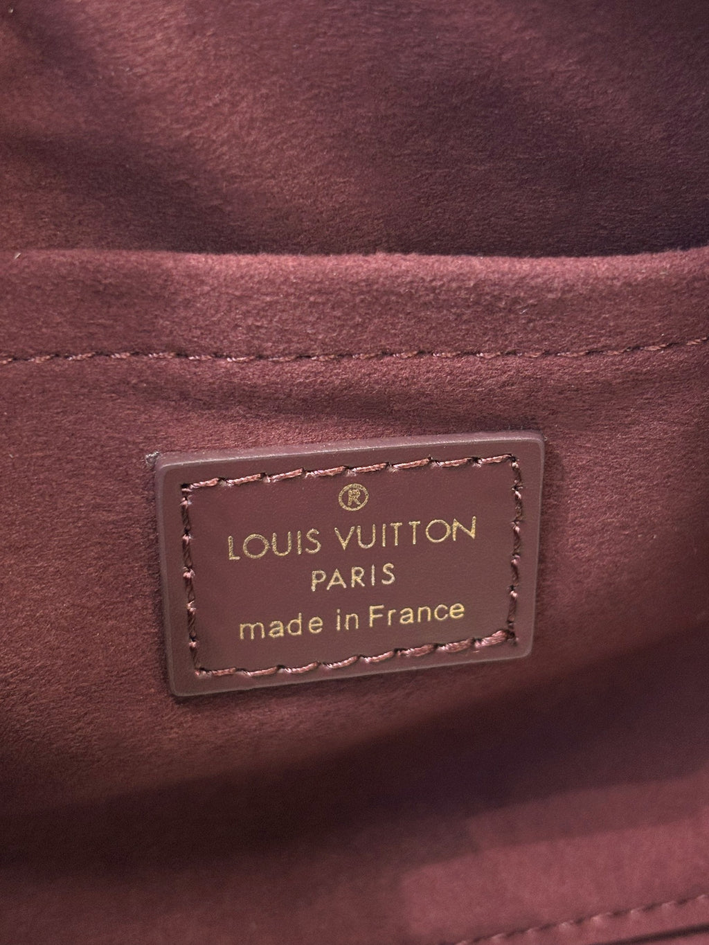 Louis Vuitton Paris made in France interior label on maroon leather bag