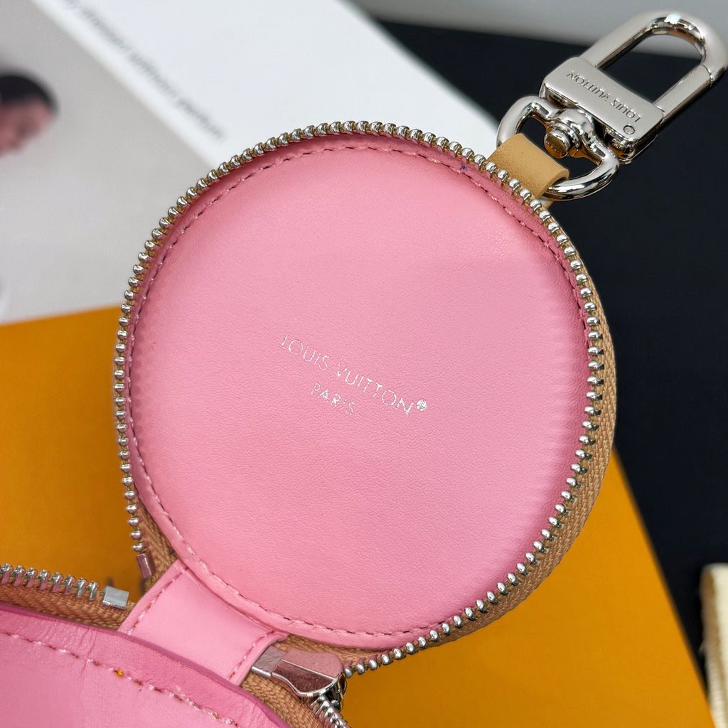 Pink leather key pouch with silver-tone zipper and top metal ring