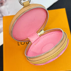 Louis Vuitton small donut key pouch with pink interior and zip closure, tan trim