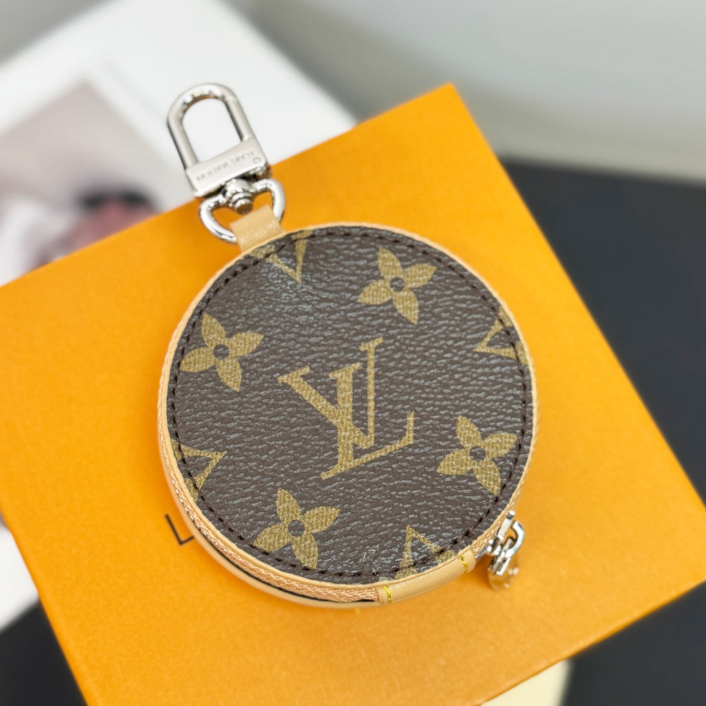 Round key pouch in dark monogram canvas with gold-tone zipper and side clasp