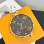 Round key pouch in dark monogram canvas with gold-tone zipper and side clasp