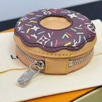 Donut-style key pouch with zipper, beige sides, and colorful top canvas