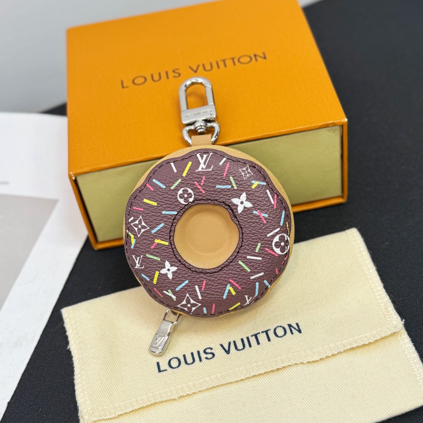Donut-shaped key pouch in dark monogram canvas with multicolor trim