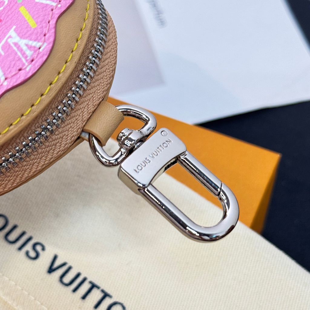 Louis Vuitton keychain clasp with engraved logo tag and silver swivel ring