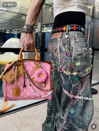 Louis Vuitton pink mini handbag with matching donut charm keychain and chain handle