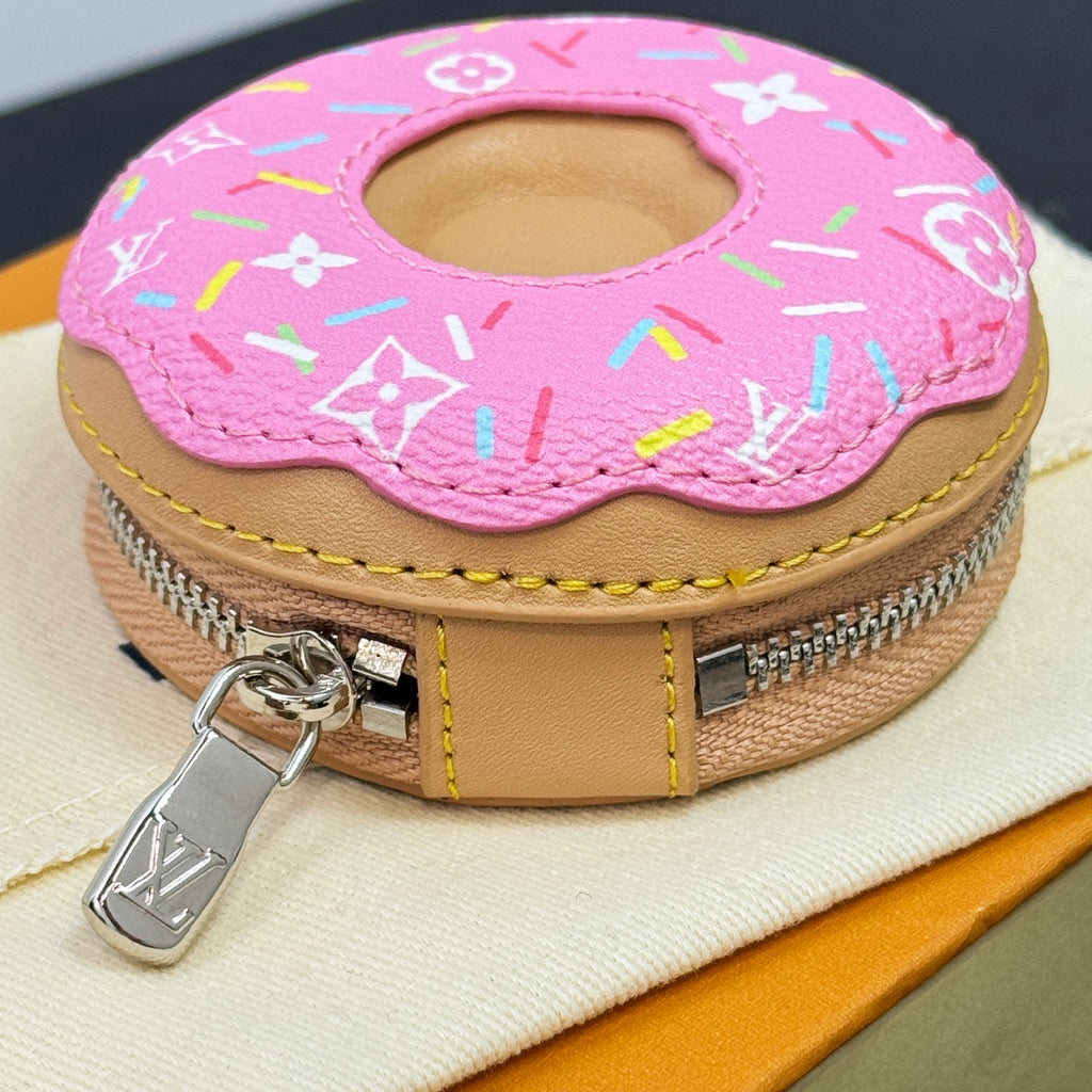 Louis Vuitton pink donut key pouch charm with colorful monogram print and yellow stitching