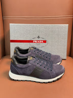 Dark blue suede lace-up sneakers with Prada logo patch and white sole
