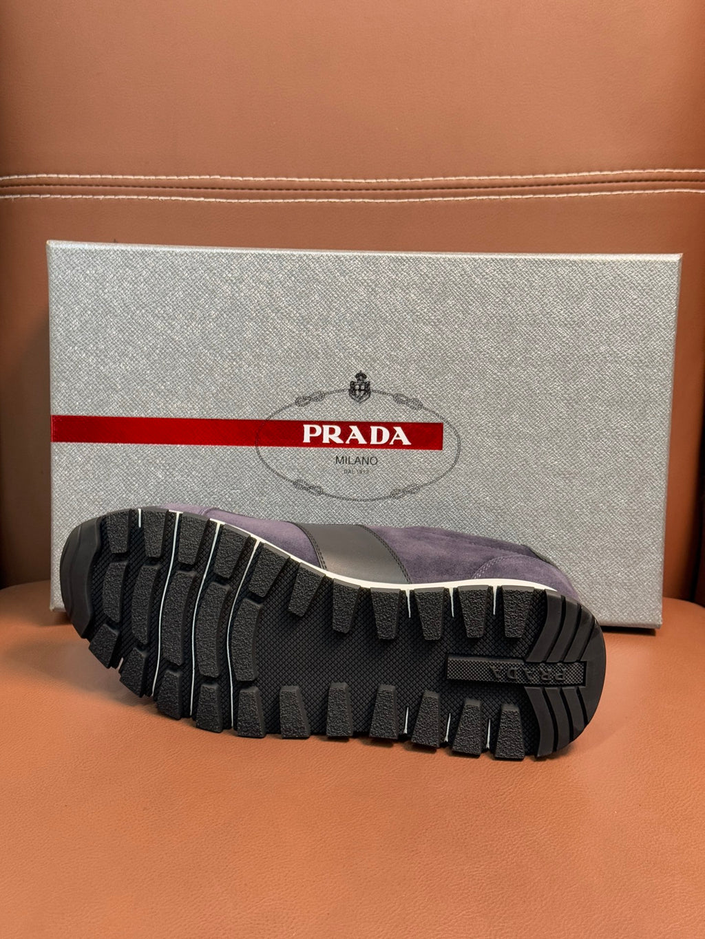 Dark blue suede sneakers outsole tread view with white midsole