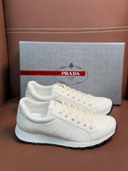 White leather lace-up sneaker with Prada branding and black rubber outsole