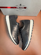 Prada unisex sneakers, dark leather lace-up shoes with white sole and side panel stitching