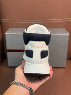 Back of lace-up sneakers with dark navy heel collar and PRADA label