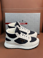 Low-top lace-up sneakers in white and dark navy with side logo patch