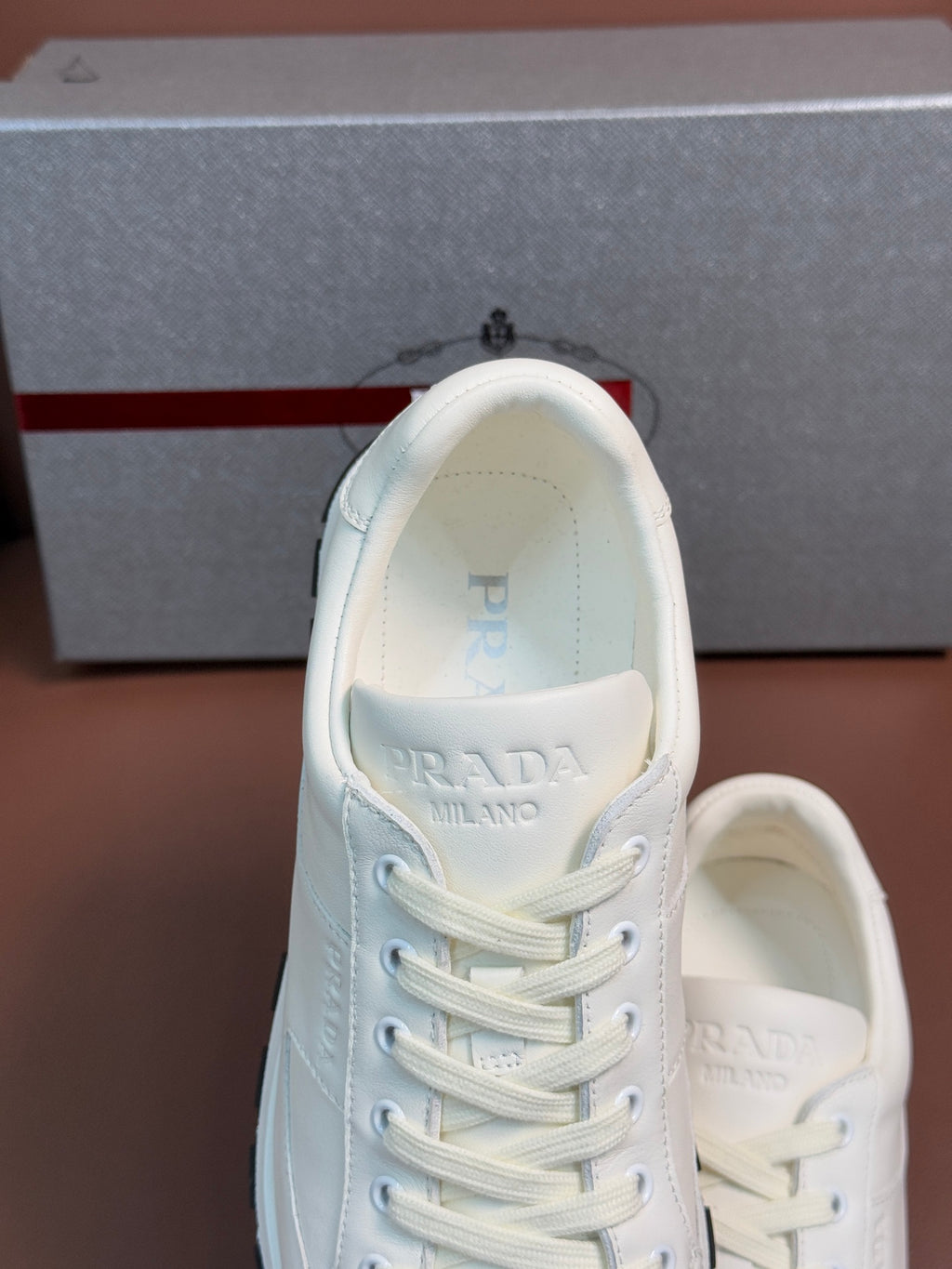 Prada unisex white sneakers, tongue and inner lining close-up
