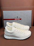 Prada unisex white low-top sneakers with lace-up and rubber sole