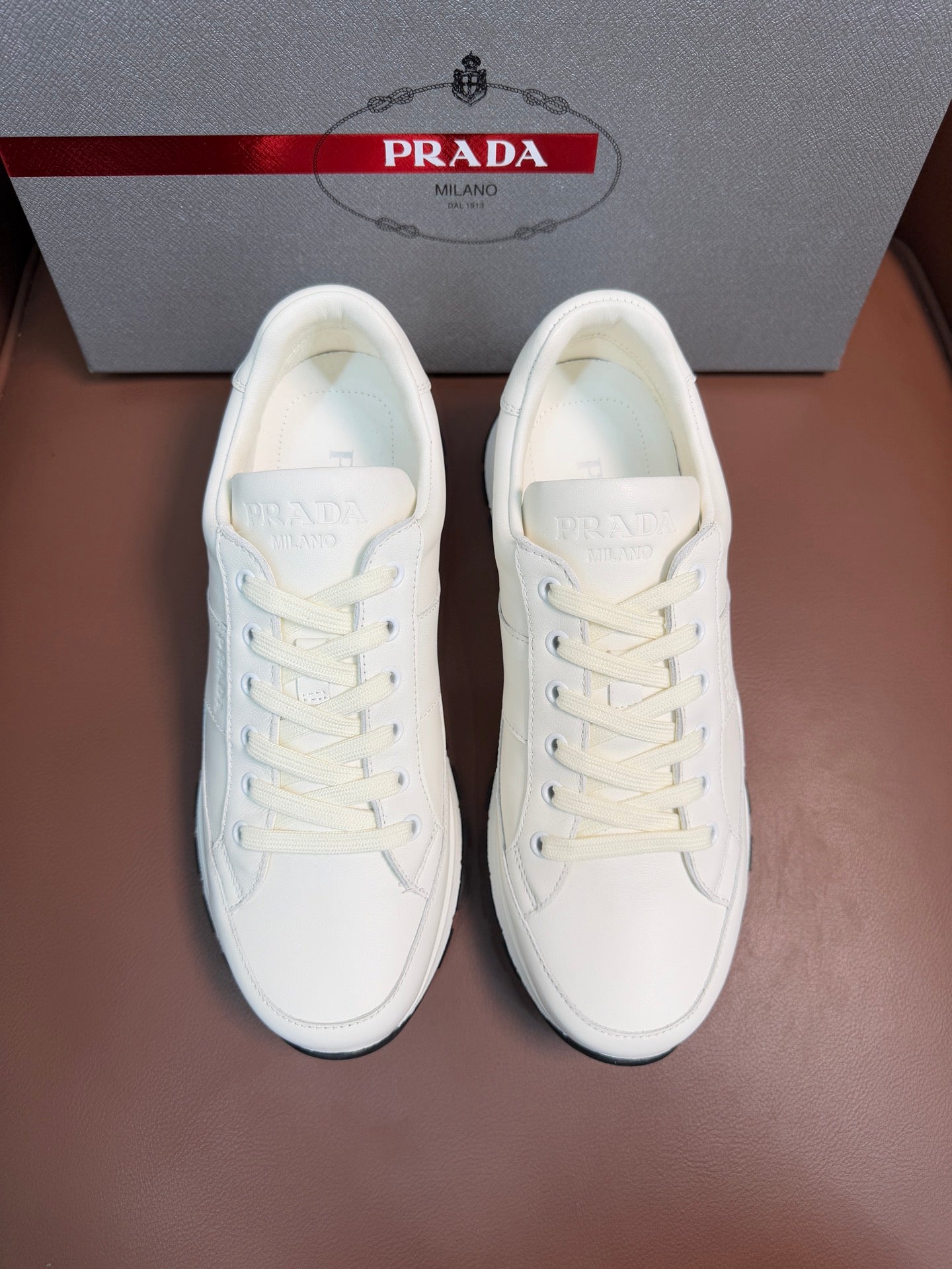 Prada unisex white sneakers with lace-up front