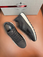 Prada unisex low-top sneakers, dark charcoal and white sole, side view