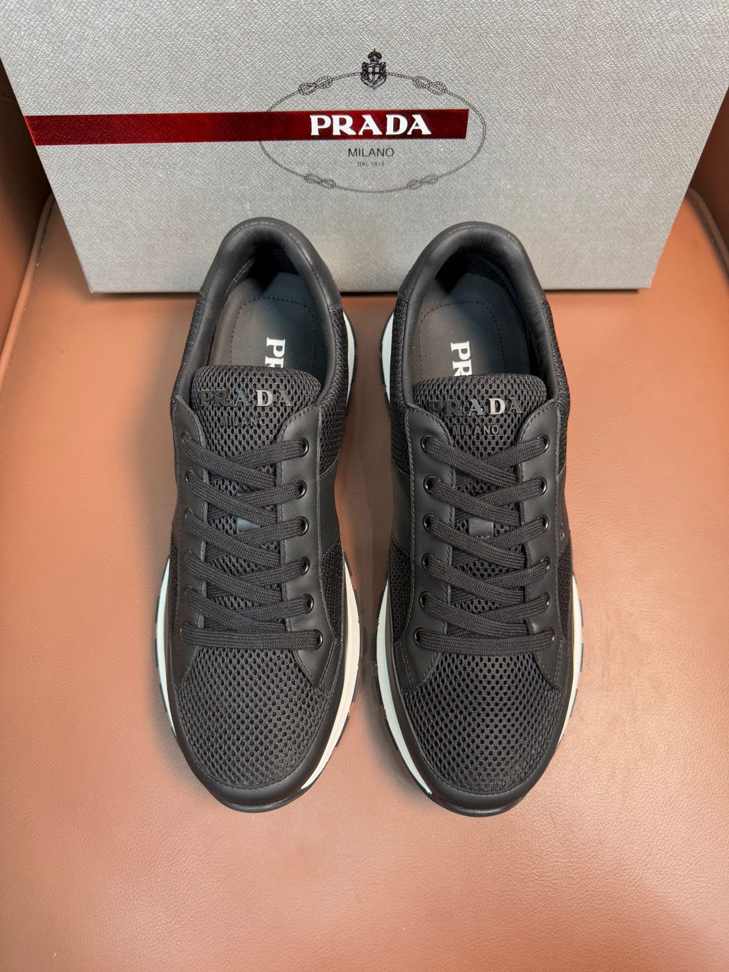 Prada unisex low-top sneakers, dark charcoal mesh upper, lace-up