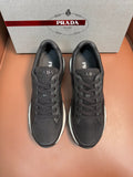 Prada unisex low-top sneakers, dark charcoal mesh upper, lace-up