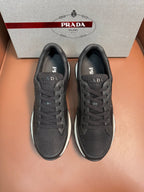Prada unisex low-top sneakers, dark charcoal mesh upper, lace-up