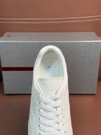 White sneaker tongue and lace-up front with interior lining visible