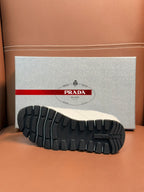 White sneaker outsole with black rubber tread pattern