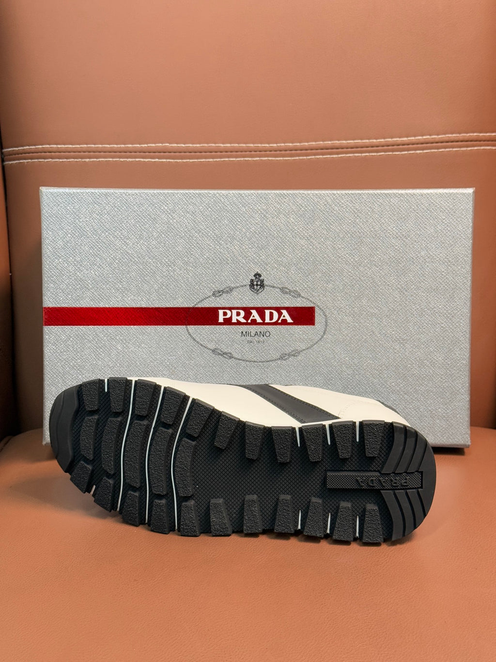 Black rubber sneaker outsole tread with white upper edge