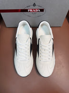 White leather unisex lace-up sneakers with Prada heel tab