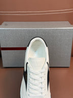 White unisex sneaker toe with lace-up rows and Prada logo on tongue