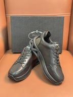 Prada dark leather sneakers with lace-up, thick sole, side logo panel