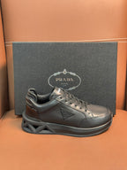 Prada dark leather lace-up sneaker with sculpted sole and logo detail