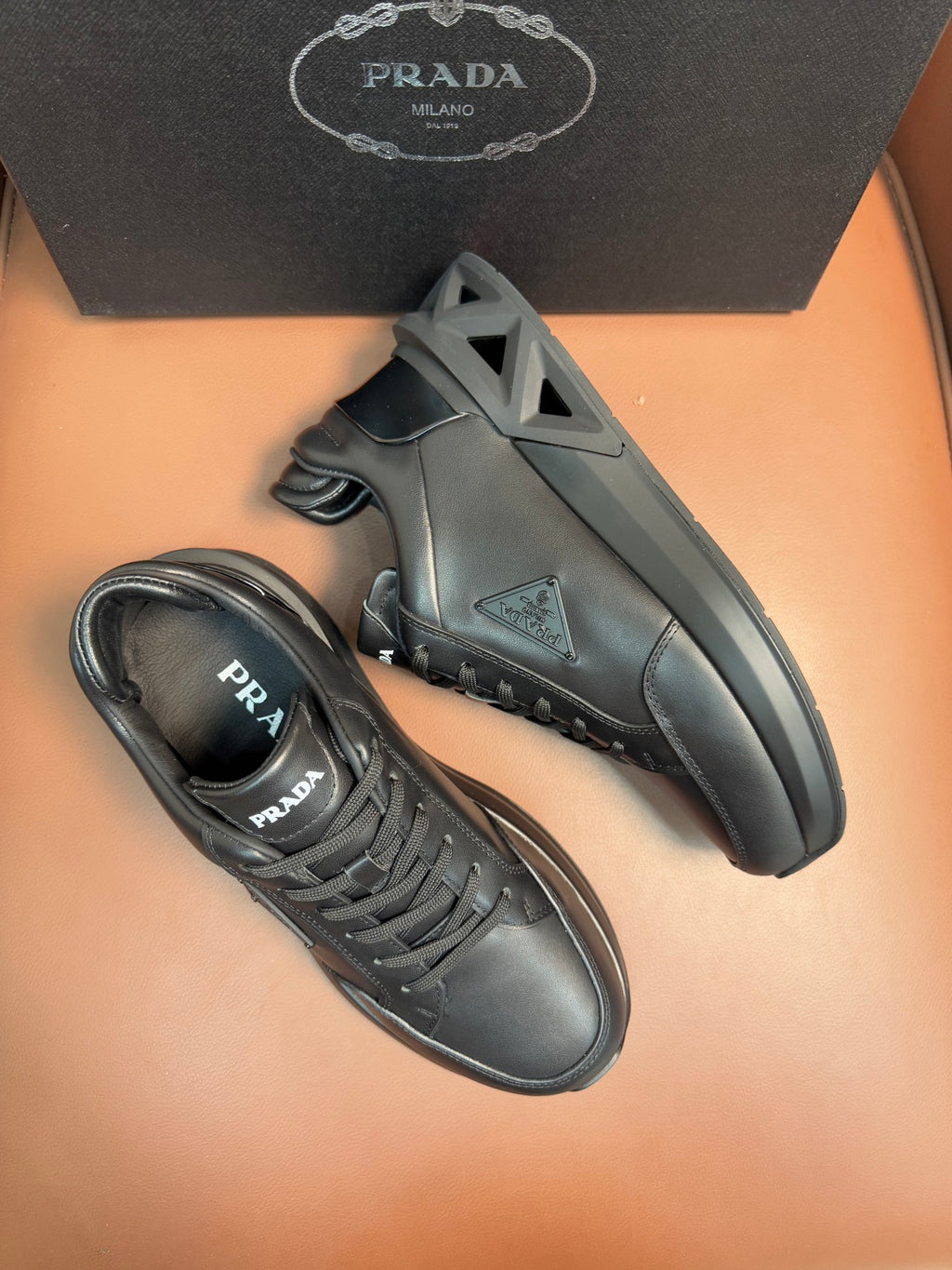 Prada dark sneakers, lace-up with chunky outsole and side logo patch