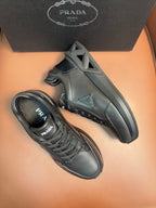 Prada dark sneakers, lace-up with chunky outsole and side logo patch